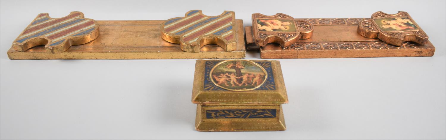 Two Continental Gilt Decorated Wooden Book Slides, One with Hinged Fleur De Lys Ends, the other with