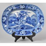 A 19th Century Blue and White "Piping Shepherd" Meat Plate, 45x34cms