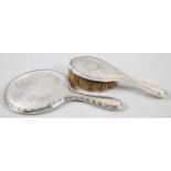 A Silver Mounted Dressing Table Hairbrush and a Silver Mounted dressing Table Mirror, Both with