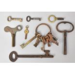 A Small Collection of Vintage Keys and a Pocket Watch Key
