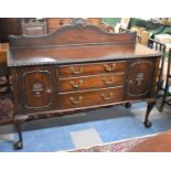 An Edwardian Mahogany Sideboard with Three Centre Drawers Flanked by Cupboards, 154cm wide