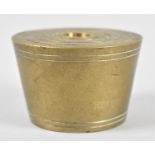 A Graduated Set of Eight Tapering Circular Brass Weights, 6.75cm Diameter