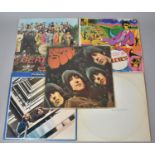 A Collection of Five Beatles LP's to Include White Album, Lonely Hearts Club etc