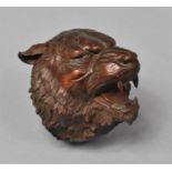 A Carved Wooden Netsuke in the Form of a Snarling Tiger, 5cm high