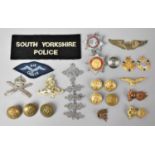 A Collection of Various Military Badges and Buttons