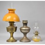 Three Oil Lamps, Two Chimneys and a Shade