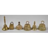 A Collection of Six Small Brass Table Bells