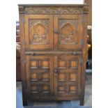 A Mid 20th Century Oak Cocktail Cabinet with Carved Panel Doors to Fitted Top Section, Pull Out