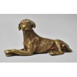 A Small Bronze Study of Reclining Hound, 7cms Long