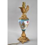A Novelty Continental Table Lamp Base in the Form of a Gilt and Porcelain Claret Jug Decorated