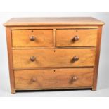 A Late 19th Century Bedroom Chest of Two Short and Two Long Drawers with Turned Wooden Handles,