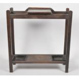 An Edwardian Oak Two Section Stick Stand with Central Hinged Lid to Glove Well, 68cm wide