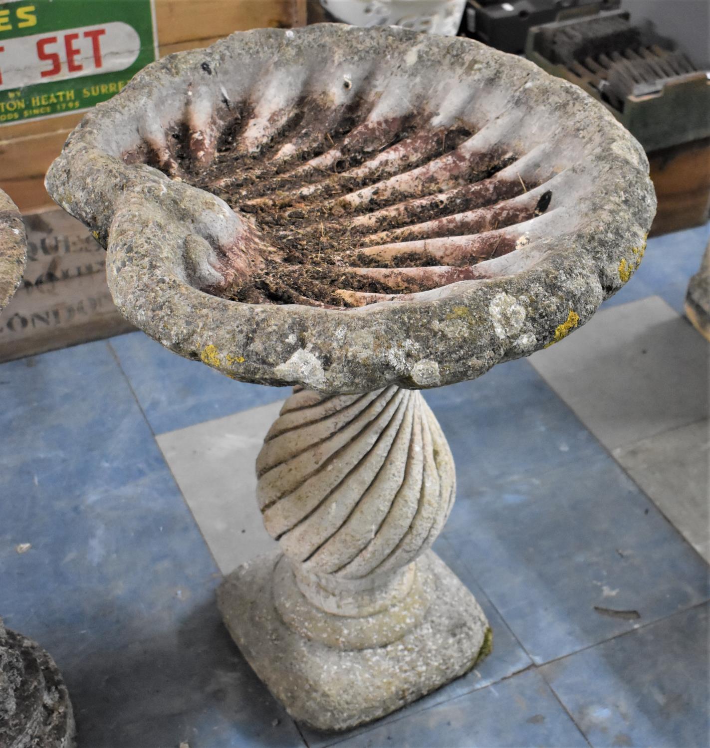 A Reconstituted Stone Garden Bird Bath in the Form of a Shell, 70cm high