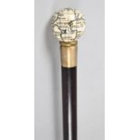 A Reproduction Novelty Ebonised Walking Cane with Globe Top Which Opens to Reveal Inner Miniature