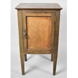 An Edwardian String Inlaid Bedside Cabinet with Panelled Doors, 42cms wide and 76cms High