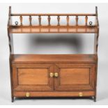 An Edwardian Oak Wall Hanging Shelf Unit with Base Drawer and Cupboard, Raised Spindled Gallery,