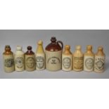 A Collection of Various Stoneware Bottles to comprise Windermere, Sheffield, Ambleside, Isle of