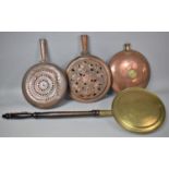 A Collection of Three Copper and One Brass Bed Pans