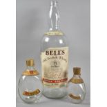 A Vintage Bell's 1 Gallon Whisky Bottle and Two Dimple Bottles