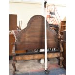 A Mahogany Double Bed Frame with Arched Headboard and Scrolled Footboard, Claw and Ball Front