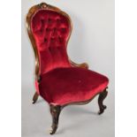 A Victorian Mahogany Framed Buttoned Upholstered Ladies Balloon Back Nursing Chair with Serpentine