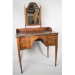 An Edwardian Serpentine Front Dressing Table on Tapering Square Supports, Centre Kneehole Flanked by