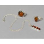 Two Silver and Amber Rings Together with a Silver and Amber Pendant