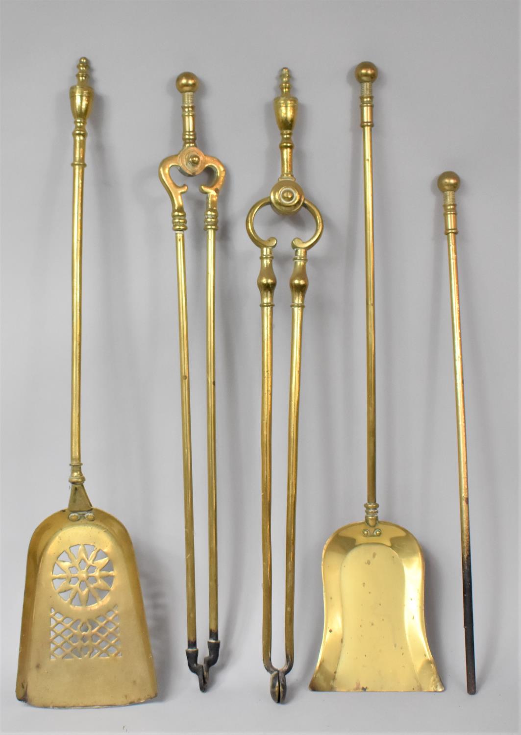 A Collection of Five Brass Long Handled Fire Irons