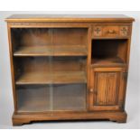 A Mid 20th Century Oak Linen Fold Bookcase, Glazed Shelf Main Section to the Side of Which is