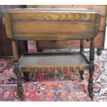 A Mid 20th Century Oak Drop Leaf Two Tier Trolley, 67cm wide