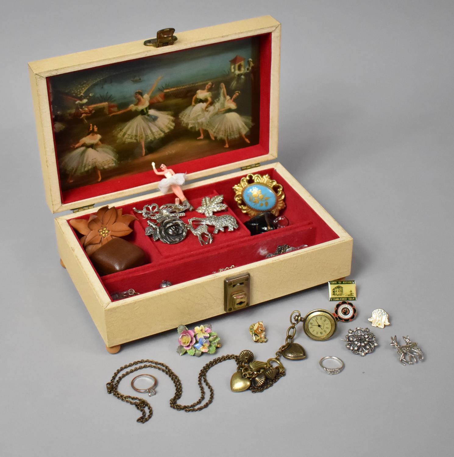 A Musical Jewellery Box Containing Costume Jewellery