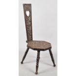 A Vintage Welsh Carved Oak Spinning Chair with Octagonal Seat and High Back with Pierced Arch and