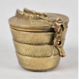 A Set of Four Cylindrical Tapering Graduated Brass Weights in Container with Hinged Lid, 5cms