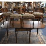 A Crossbanded Mahogany Drop Leaf Pembroke Style Table with Single Drawer Together with Four