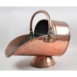 A Late Victorian Copper Helmet Shaped Coal Scuttle, 43cm Long