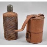 A Small Vintage Leather Cased Travelling Set Containing Two Glass Flasks Together with a Caned
