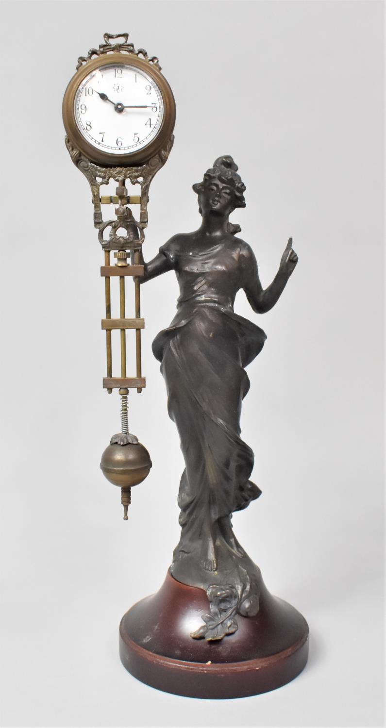 A Reproduction Bronze Spelter Mystery Clock in the Form of an At Nouveau Maiden with Finger Pointing - Bild 2 aus 3