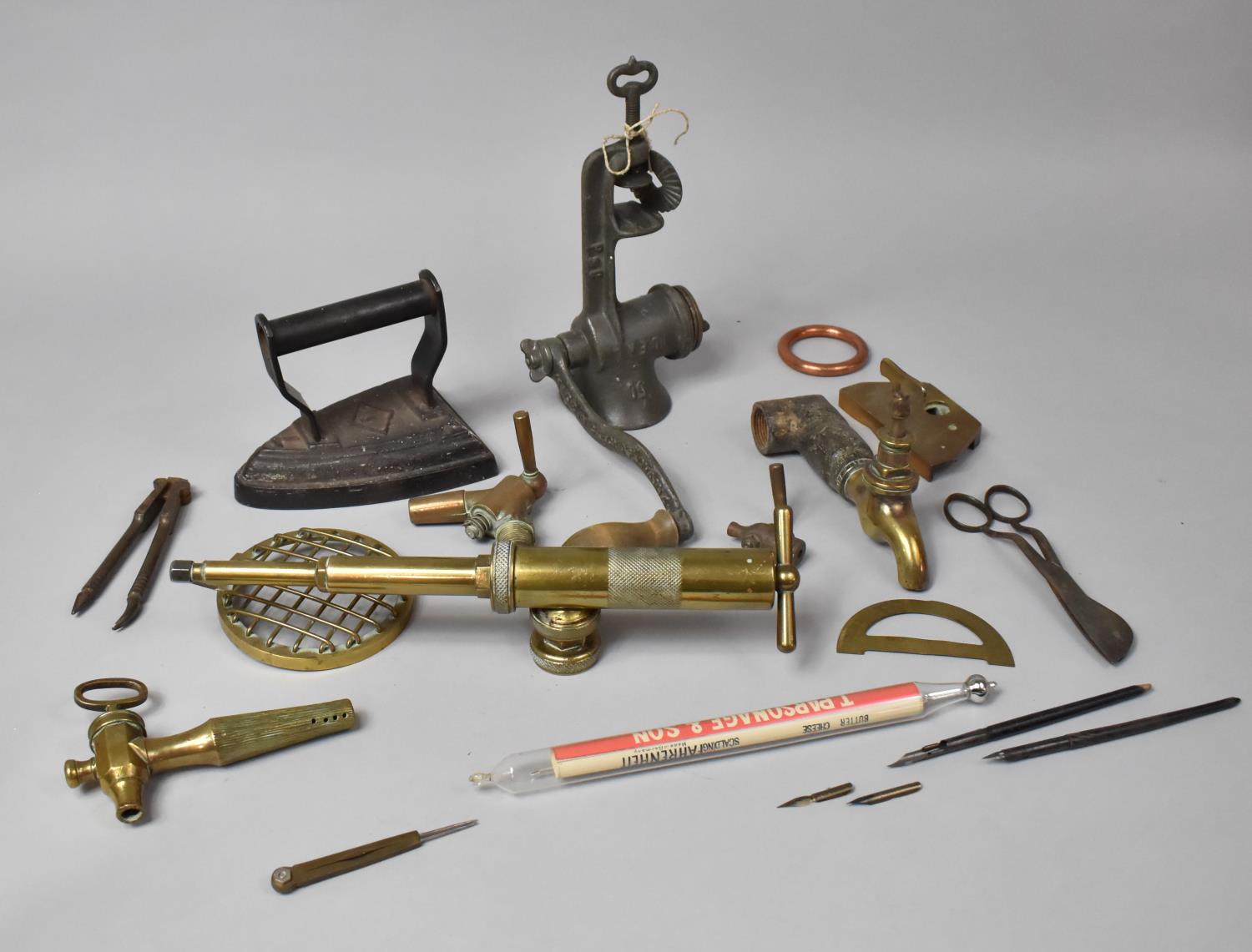A Collection of Metalwares to Include Brass Taps, Brass Sprayer Head, Flat Iron, Mincer etc