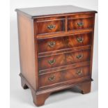A Reproduction Mahogany Miniature Chest of Two Short and Three Long Drawers on Bracket Feet, 44cm