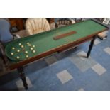 A Victorian Mahogany Folding Bagatelle Table with Beize Playing Surface on Pull Out Stand with