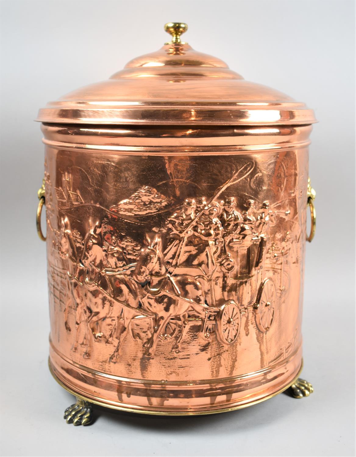 A Modern Cylindrical Copper Coal Bucket Decorated in Relief with Coaching Scenes, Twin Brass Lion