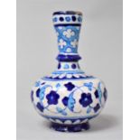 An Iznik Type Bottle Vase with Knopped Stem and Squat Baluster Body, Decorated in Blue Enamels, 14cm