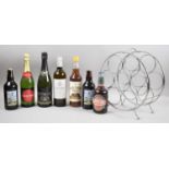 A Collection of Sparkling Wines, Commemorative Beers and a Circular Wine Rack