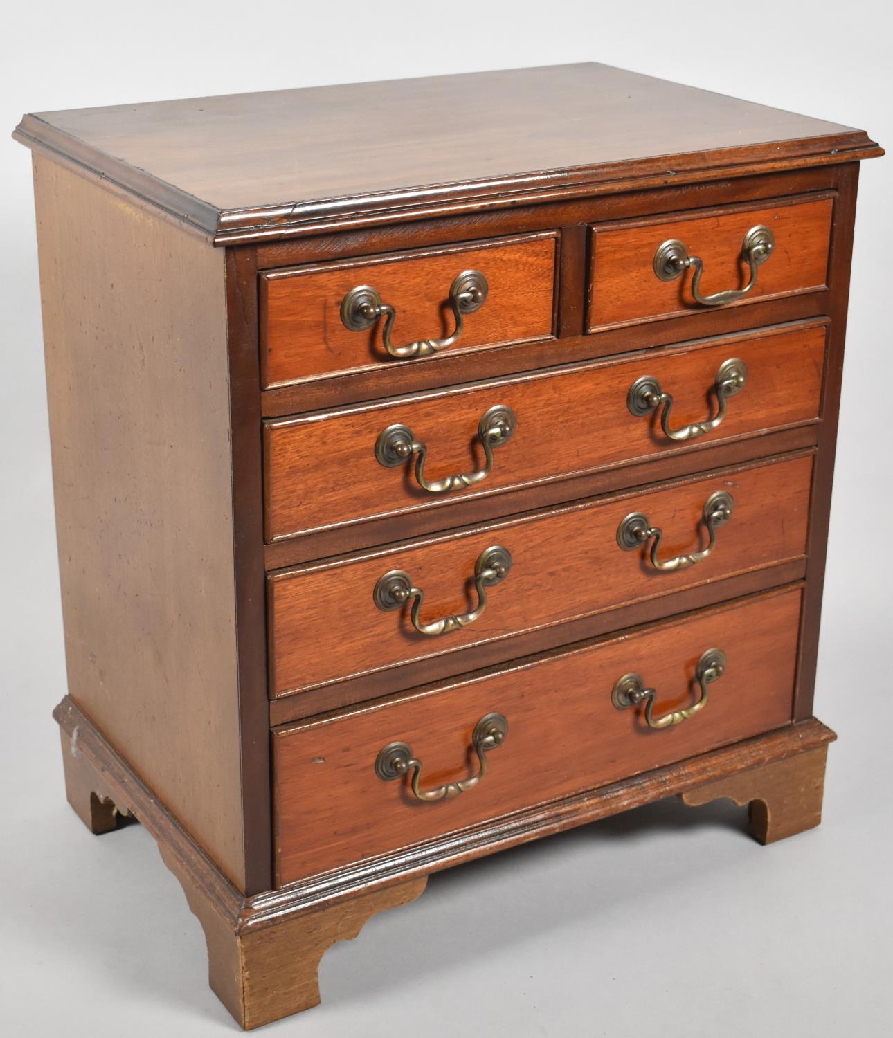 A Reproduction Miniature Mahogany Chest of Two Short and Three Long Drawers, Bracket Feet, 54cm