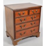 A Reproduction Miniature Mahogany Chest of Two Short and Three Long Drawers, Bracket Feet, 54cm