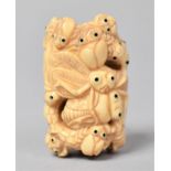 A Carved Bone Netsuke in the Form of Entwined Black Eyed Bugs, Signed, 5cm long