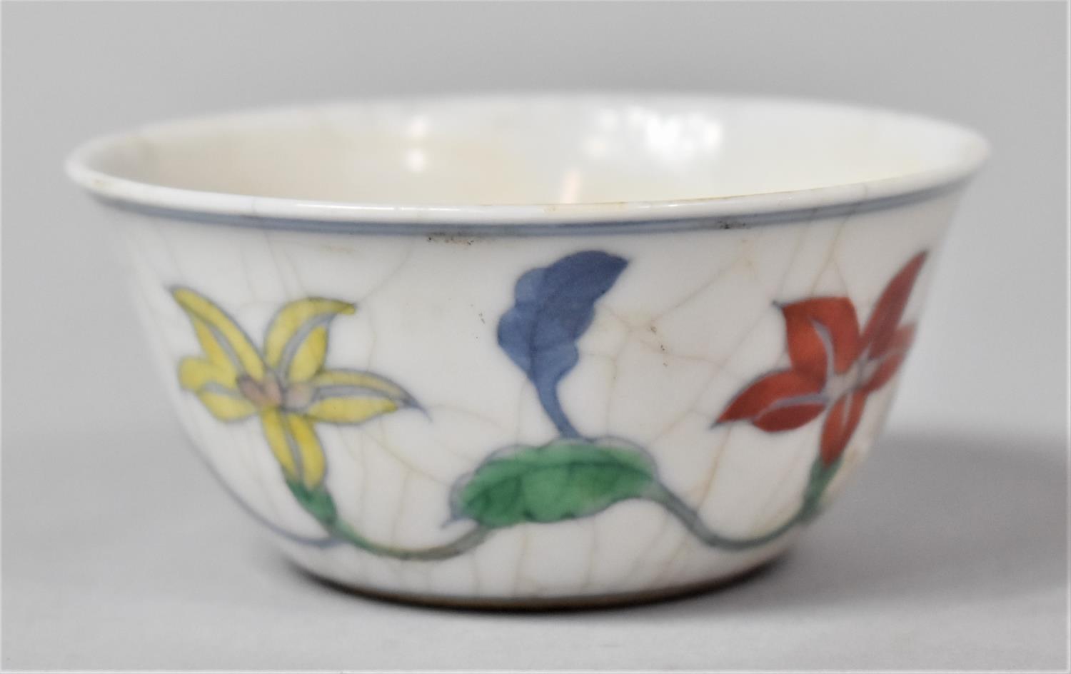 A Chinese Porcelain Crackle Glazed Wucai Teacup Decorated with Band of Flowers, Underglaze Six - Image 2 of 4