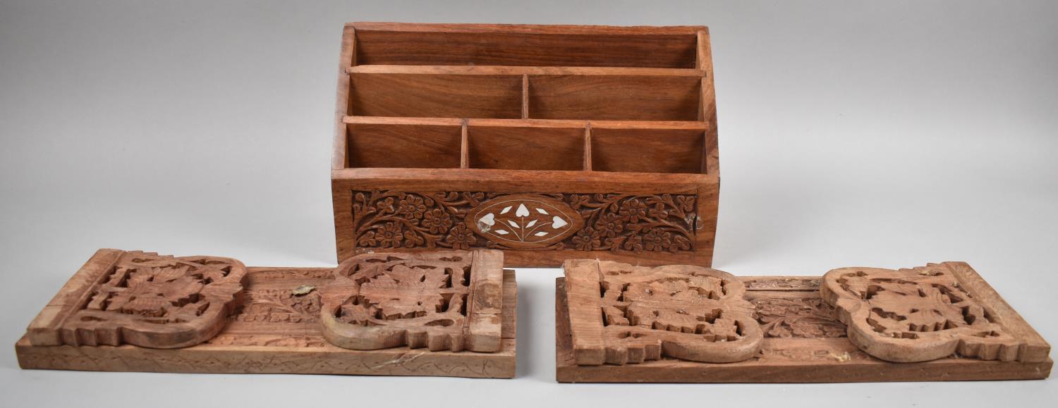 A Far Eastern Teak Stationery Rack and Two Carved Book Slides, 31cm Wide