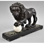 A Cast Metal Study of Lion with Paw Resting on Globe, Set on Rectangular Marble Plinth, Possibly