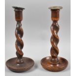 A Near Pair of Edwardian Oak Barley Twist Candle Sticks, 25cm high